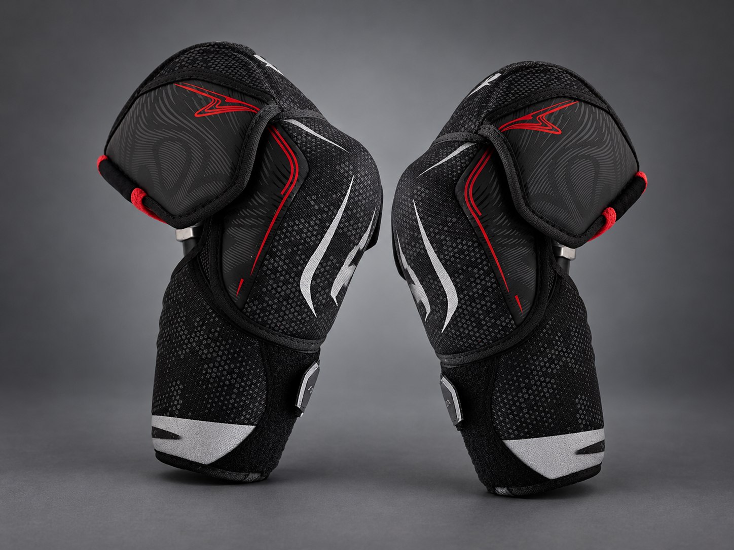 Black and red custom hockey elbow pad development sample